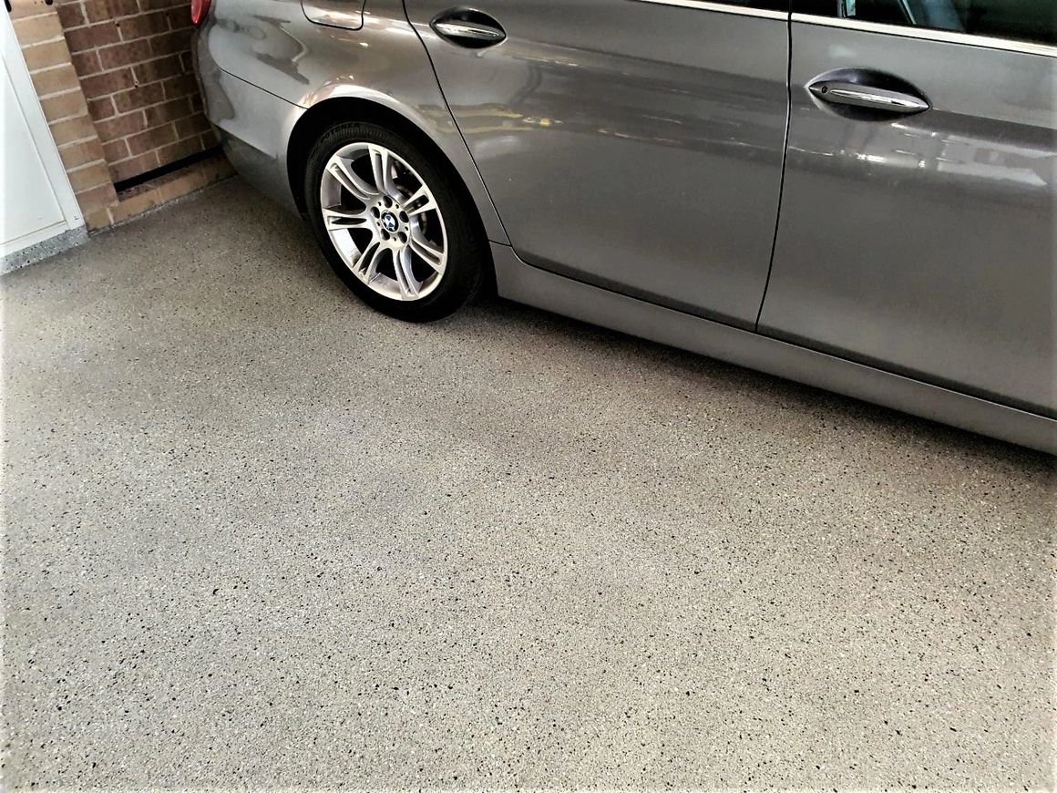 When simple is best. Sydney Wide Concrete Coatings let the natural character of the concrete flecks take centre stage on this driveway surface.