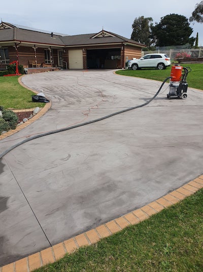 This faded concrete driveway was given new life by the team at Spray Pave Melbourne.