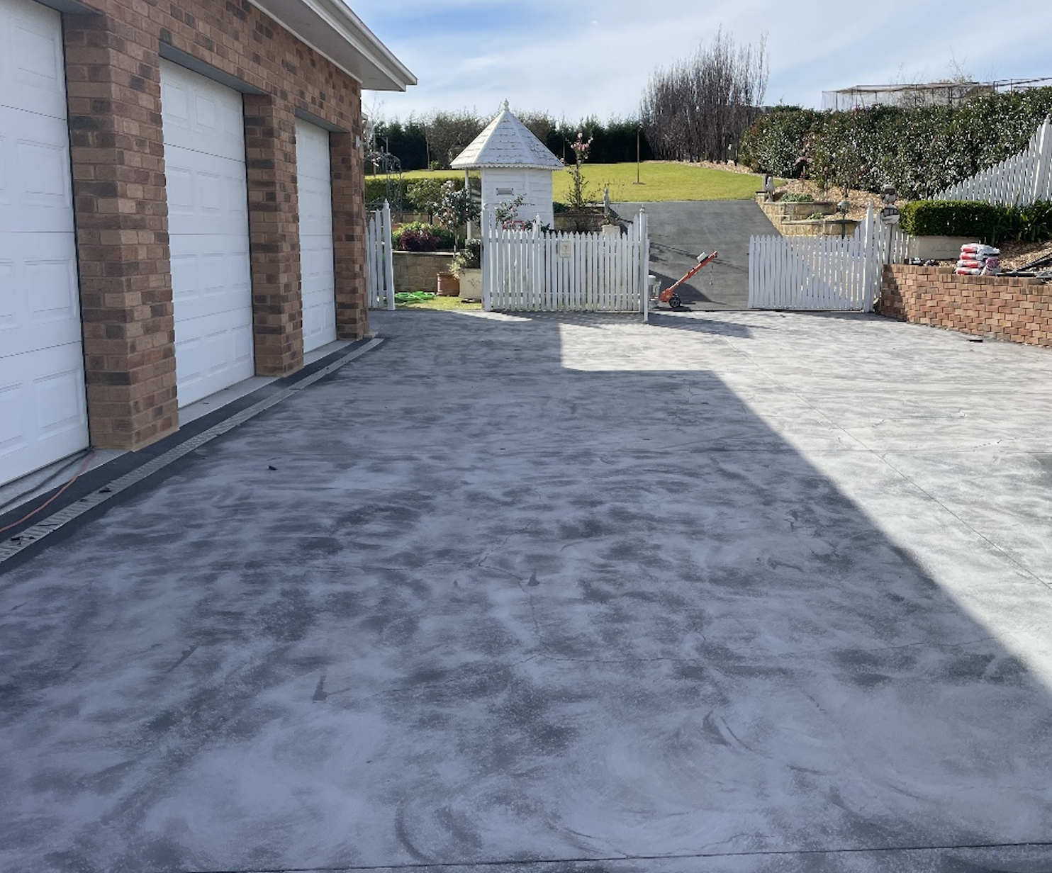 Before - This rural driveway was covered in a network of fine cracks and lacked the strength to handle vehicle traffic. 