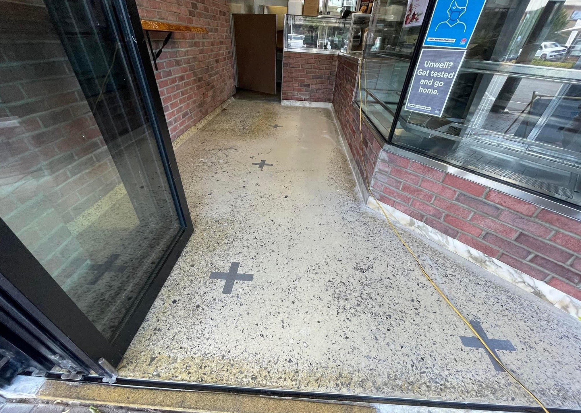 Before: this aged, discoloured epoxy flooring looked scruffy and was getting harder to clean.