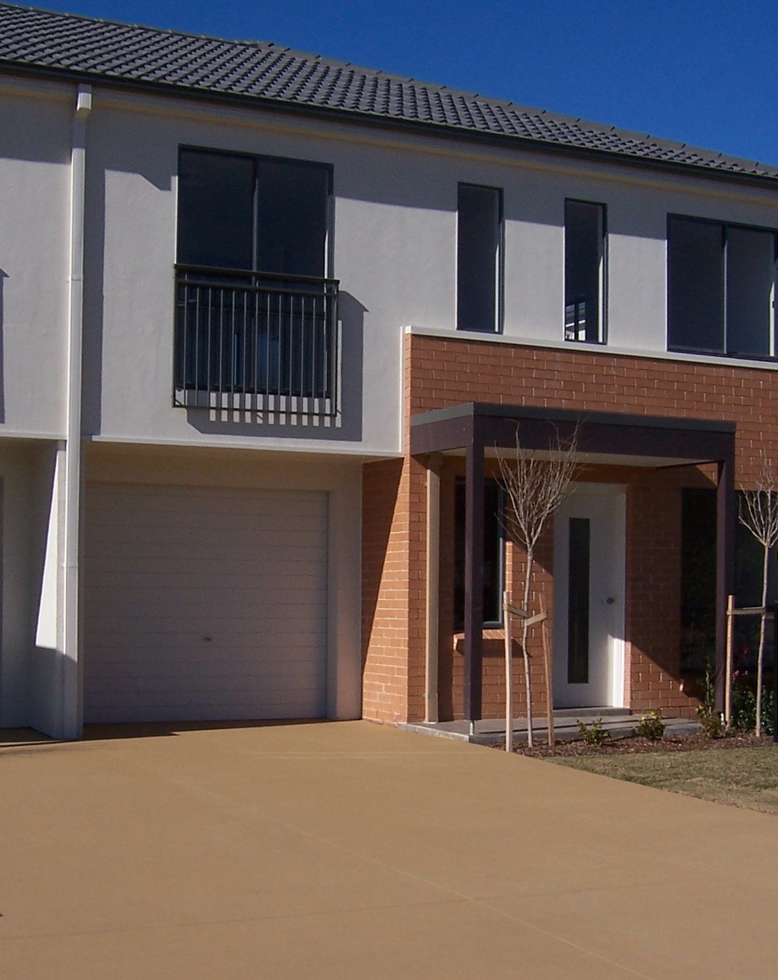 Our Colour Through Oxide in Coastal Stone has been mixed through the concrete pour to create this driveway..