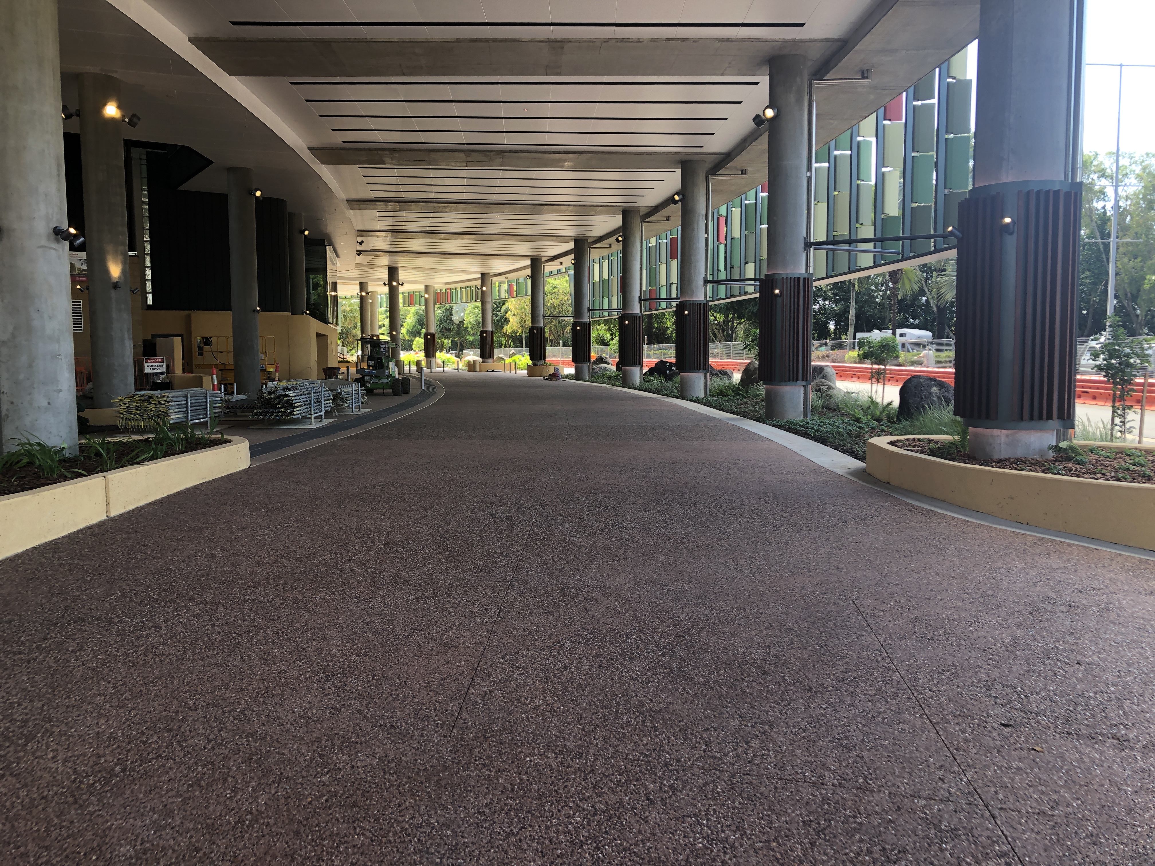 Dulux Avista Exposed Aggregate Concrete Sealer protected and enhanced the rich terracotta hues of the driveways at Queensland's Cairns Convention Centre.
