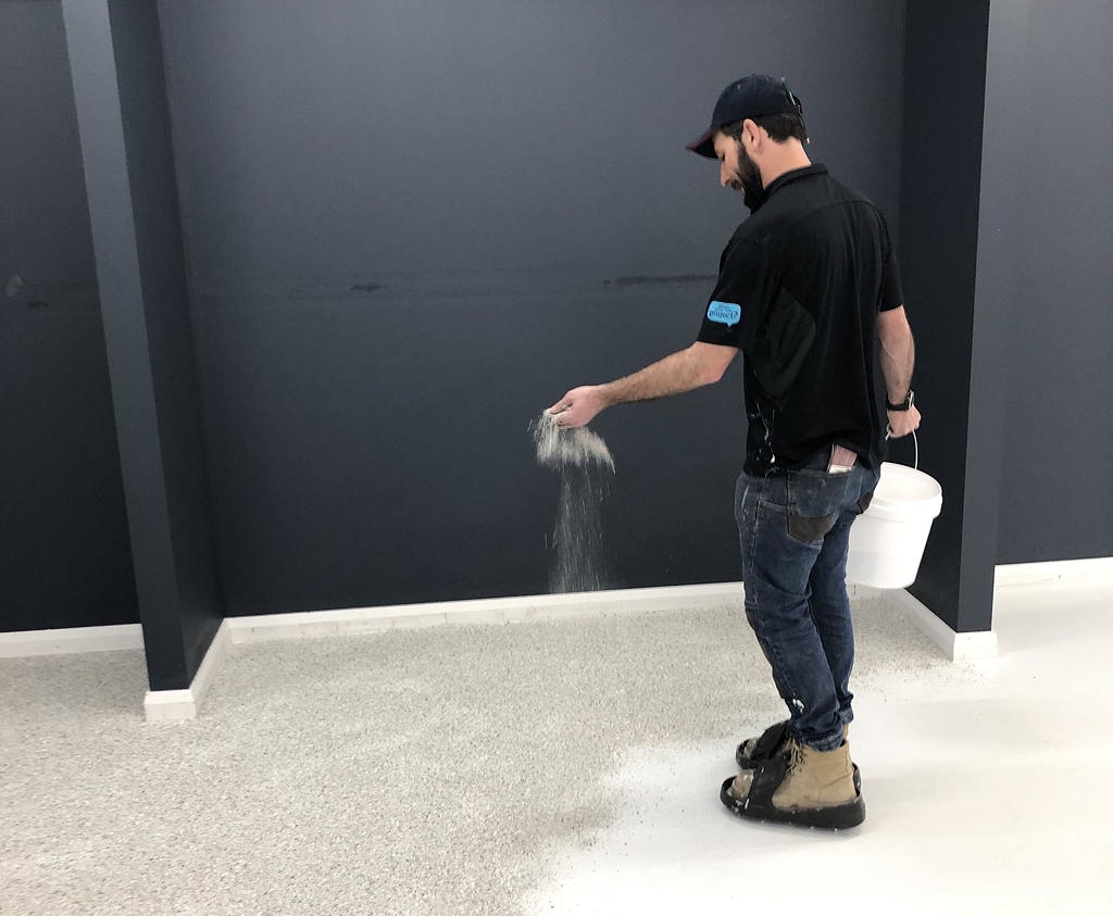 Dulux Avista Natural Stone Look Flakes in Dalmatian Stone were used in a feature corner of the shop floor.