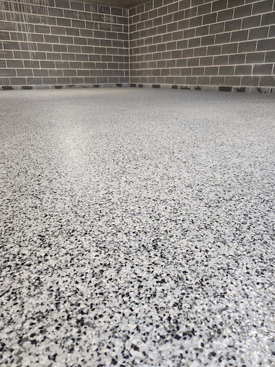 This garage floor was created using Dulux Avista Decorative Flakes.