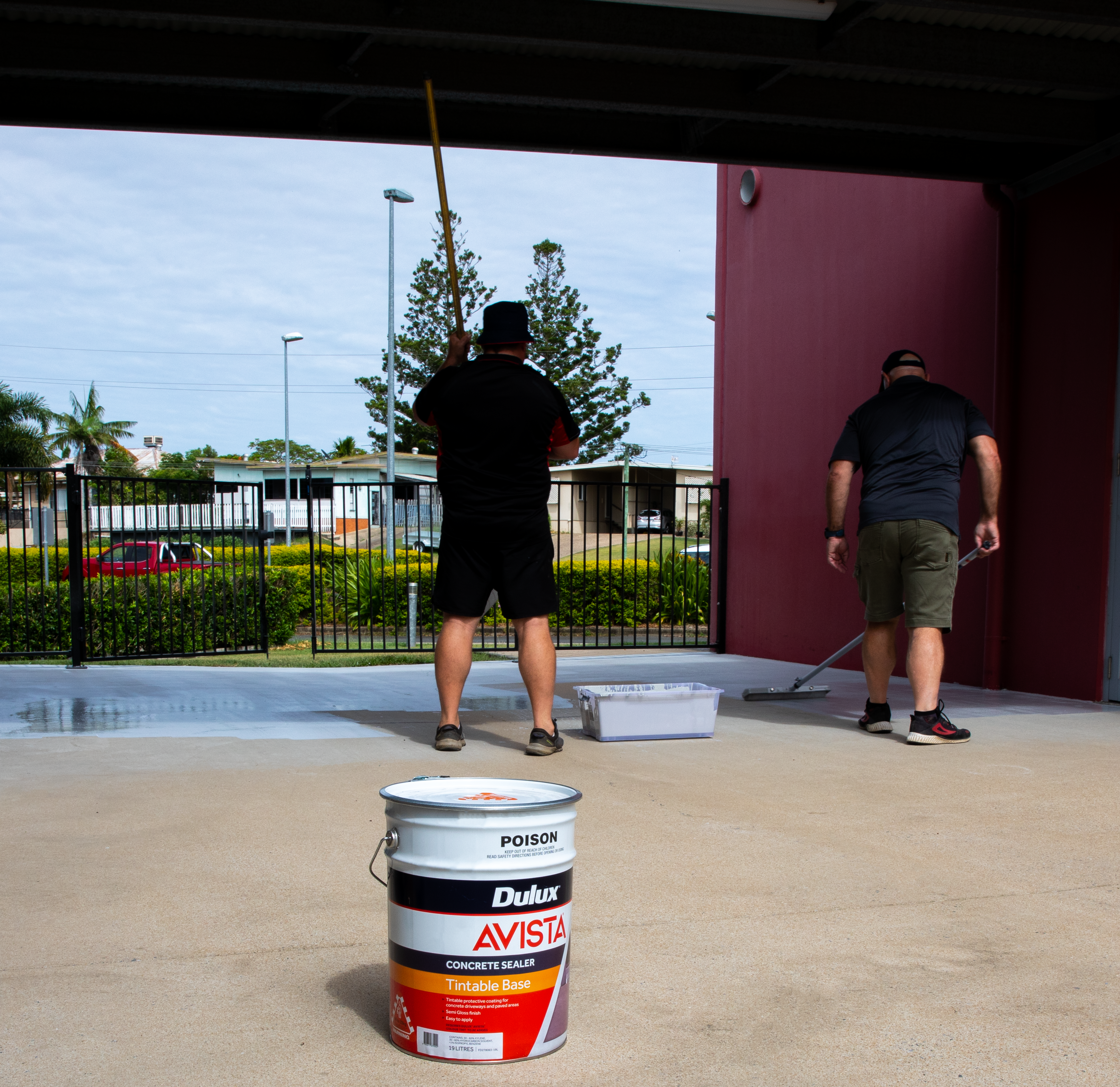 Dulux Avista Concrete Sealer was tinted with Shale Grey. This photo shows the colour transformation underway.